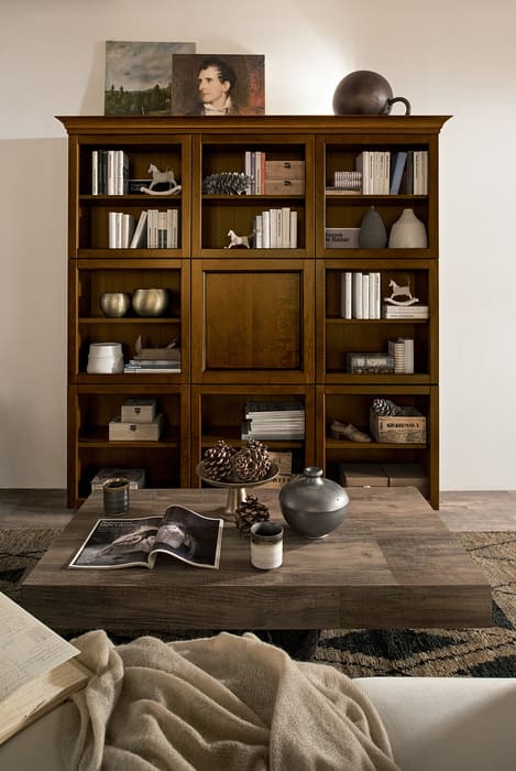 Composizione libreria con elementi a giorno con telaio in bugna