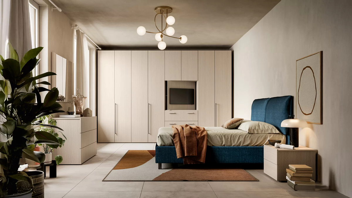 Camera con armadio a ante battenti, vano porta TV con cassetti inferiori, letto con contenitore e gruppo comodini/comò
