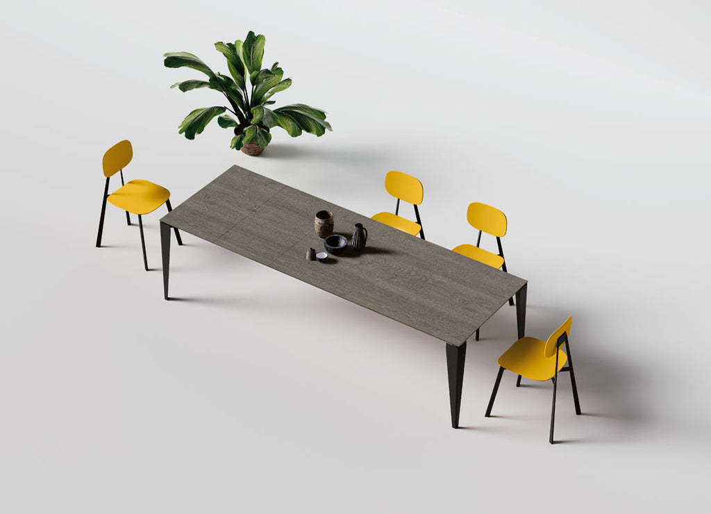 Tavolo allungabile con gambe metalliche stondate scure
